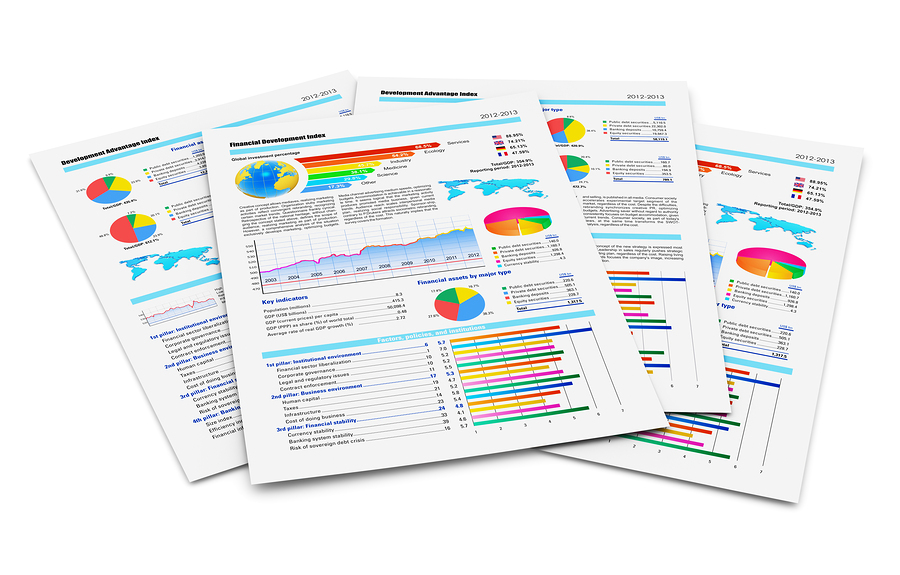 Stack of paper documents with financial reports with color bar graphs pie charts and statistic information data isolated on white background